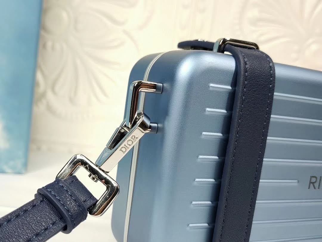 Presentation image of the Dior x Rimowa aluminum clutch details